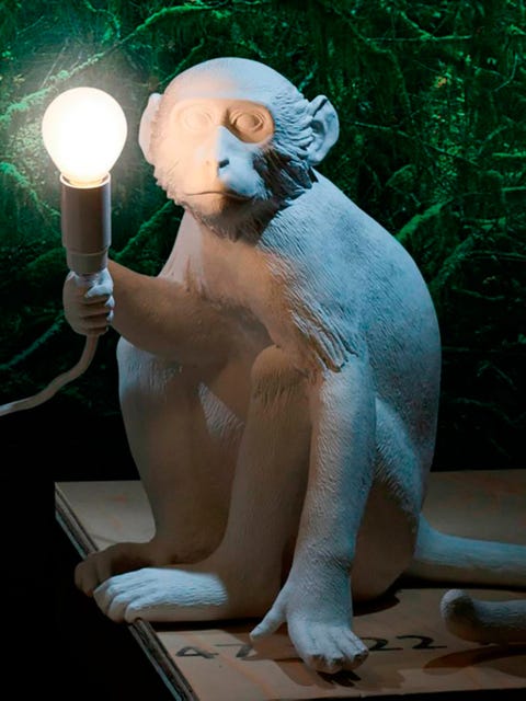 Sculpture, Candle holder, Art, Candle, Foot, Statue, Creative arts, Bear, Toe, Animal figure, 