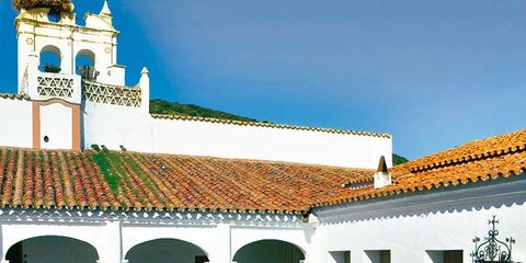 Place of worship, Courtyard, Hacienda, Arch, Urban design, Outdoor furniture, Holy places, Finial, Idiophone, 