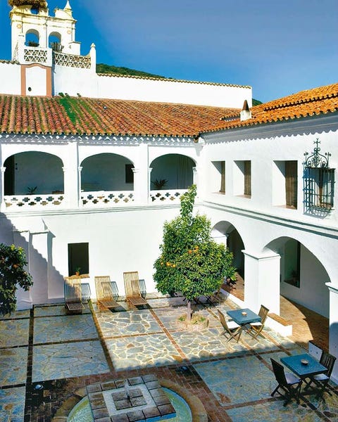 Place of worship, Courtyard, Hacienda, Arch, Urban design, Outdoor furniture, Holy places, Finial, Idiophone, 