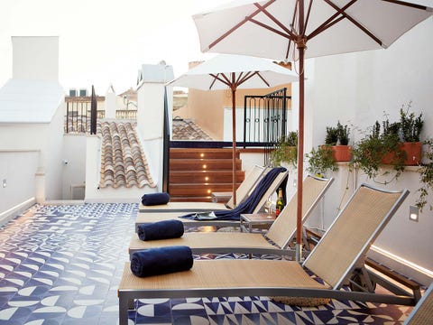 Real estate, Flooring, Floor, Outdoor furniture, Sunlounger, Carpet, Shade, Home, Umbrella, Armrest, 