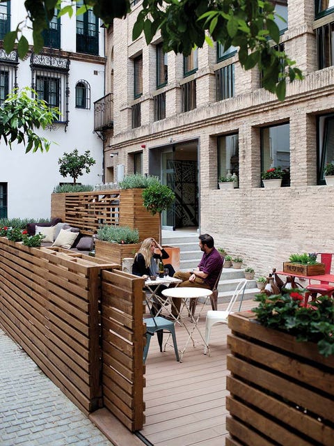 Window, Outdoor furniture, Hardwood, Outdoor table, Cobblestone, Street furniture, Flowerpot, Brick, Armrest, Lumber, 