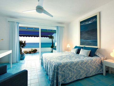 Bed, Lighting, Green, Room, Blue, Interior design, Floor, Wood, Ceiling fan, Property, 