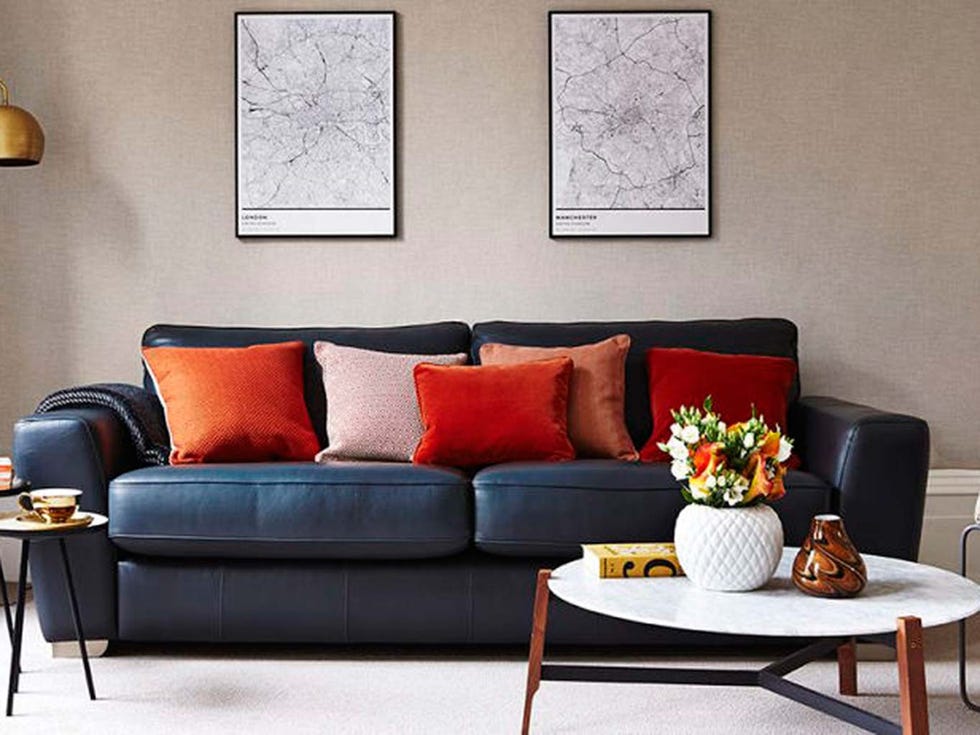 Living room, Furniture, Couch, Room, Interior design, Orange, Sofa bed, Table, Wall, Coffee table, 