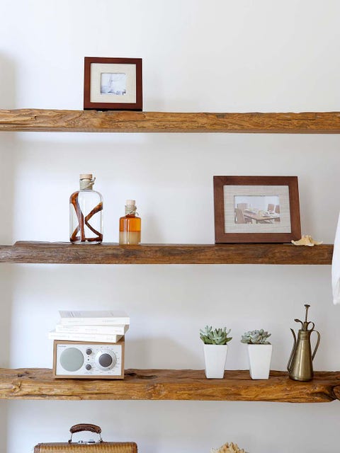 Wall, Interior design, Still life photography, Picture frame, Artifact, Houseplant, Flowerpot, Cross, Collection, Religious item, 