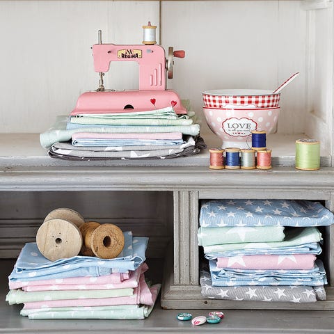 Textile, Shelving, Linens, Paper, Dishware, Household supply, Paper product, Serveware, Home accessories, Banknote, 