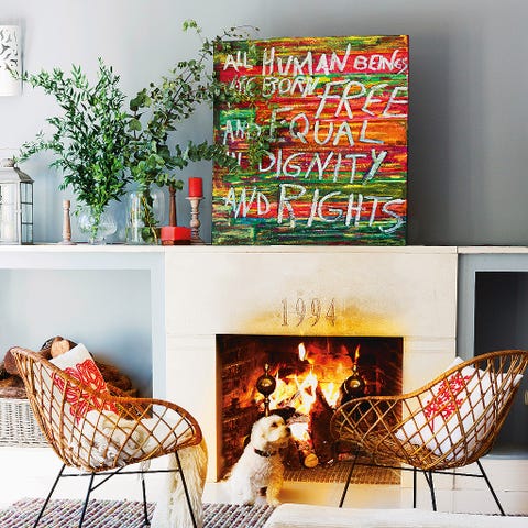 Living room, Room, Furniture, Wall, Rooster, Interior design, Fireplace, Hearth, Christmas stocking, Christmas decoration, 