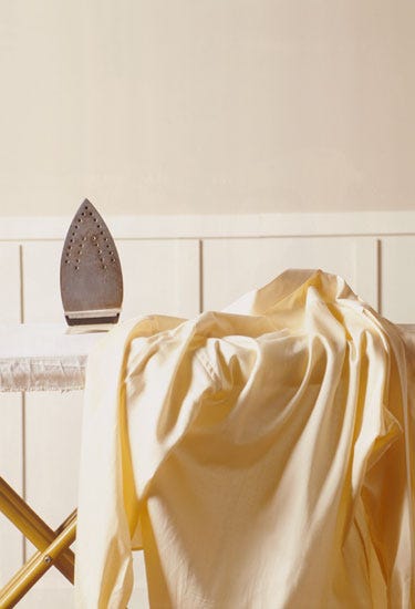 Furniture, Room, Yellow, Textile, Interior design, Beige, Linens, Bed sheet, Table, Bedroom, 