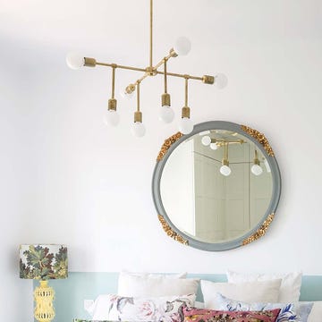 Room, Wall, Lighting, Ceiling, Brass, Mirror, Chandelier, Metal, Furniture, Light fixture, 