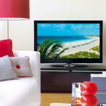 Display device, Interior design, Room, Flat panel display, Red, Living room, Television set, Wall, Pillow, Interior design, 