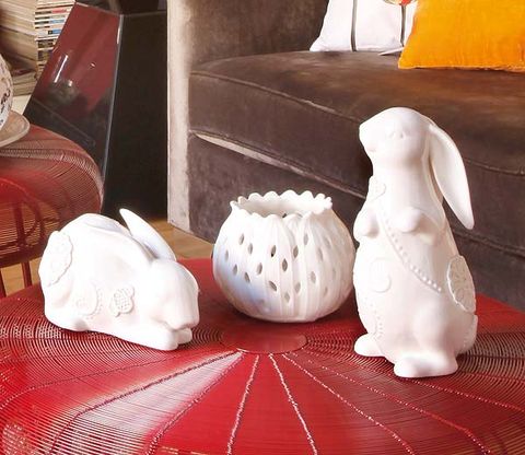 Porcelain, Living room, Interior design, Ceramic, Couch, Toy, Rabbits and Hares, Artifact, Club chair, Home accessories, 