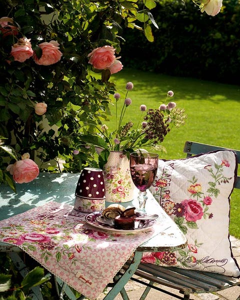 Tablecloth, Table, Furniture, Petal, Linens, Botany, Outdoor furniture, Home accessories, Garden, Centrepiece, 