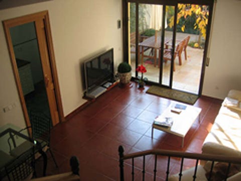 Wood, Floor, Room, Property, Flooring, Interior design, Home, Hardwood, Television set, House, 