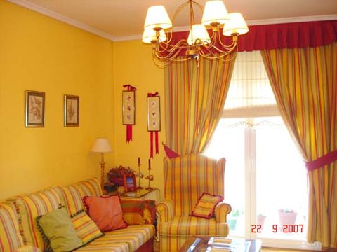 Interior design, Room, Yellow, Textile, Couch, Orange, Living room, Interior design, Window covering, Window treatment, 