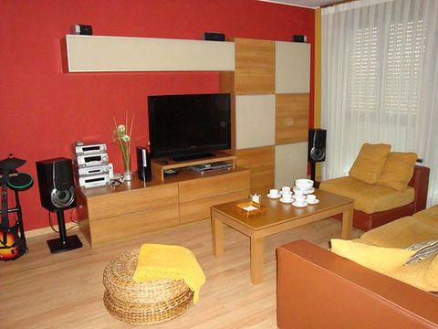 Room, Interior design, Living room, Furniture, Drum, Table, Electronic device, Wall, Display device, Coffee table, 