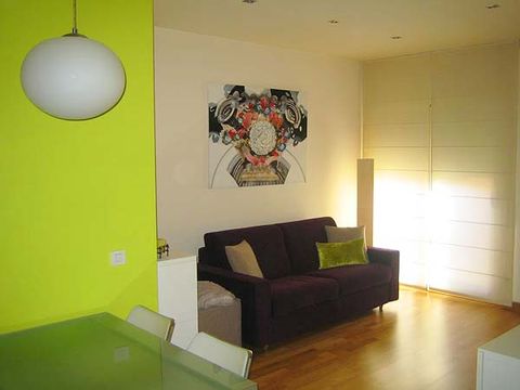 Green, Interior design, Room, Wall, Floor, Couch, Ceiling, Flooring, Light fixture, Living room, 