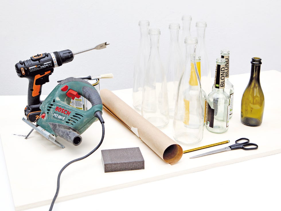 Bottle, Bottle cap, Glass bottle, Drill, Machine, Tool, Wire, Power tool, Household supply, Drill accessories, 