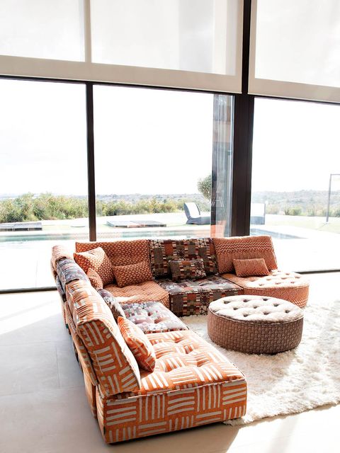 Brown, Interior design, Floor, Room, Couch, Flooring, Daylighting, Glass, Fixture, Pillow, 