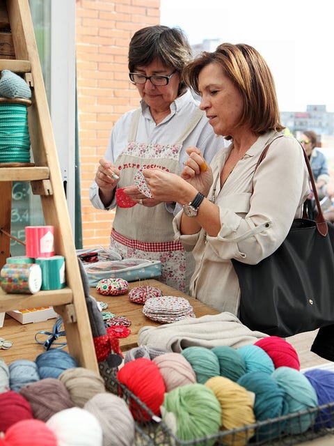 Glasses, Textile, Public space, Market, Wool, Marketplace, Shelving, Thread, Human settlement, Street fashion, 