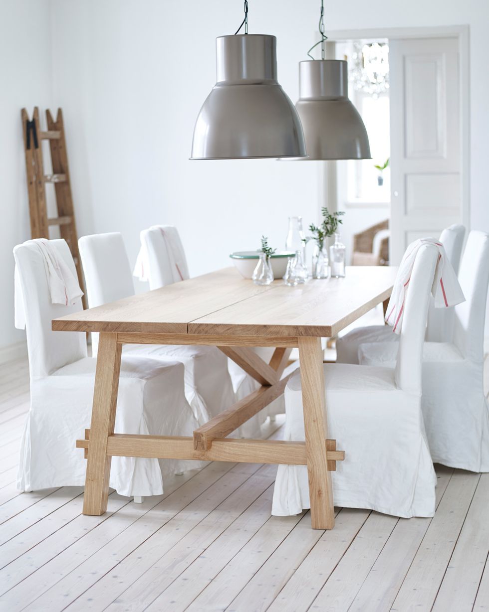 dining room with wooden table and white chairs