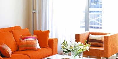 Room, Interior design, Living room, Furniture, Table, Orange, Couch, Home, Wall, Coffee table, Room, Interior design, Living room, Furniture, Table, Orange, Couch, Home, Wall, Coffee table,