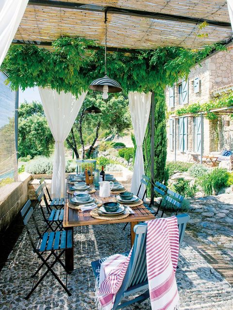 Textile, Tablecloth, Linens, Outdoor furniture, Outdoor table, Flag, Home accessories, Shade, Outdoor structure, Kitchen & dining room table, 