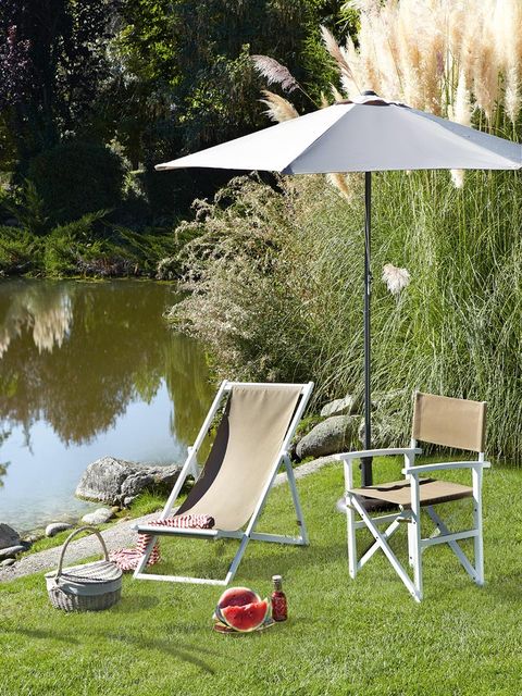 Umbrella, Outdoor furniture, Pond, Chair, Shade, Garden, Folding chair, Lawn, Reservoir, Armrest, 