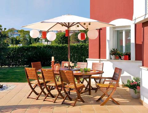 Table, Furniture, Flowerpot, Outdoor table, Outdoor furniture, Chair, Umbrella, Shade, Door, Houseplant, 
