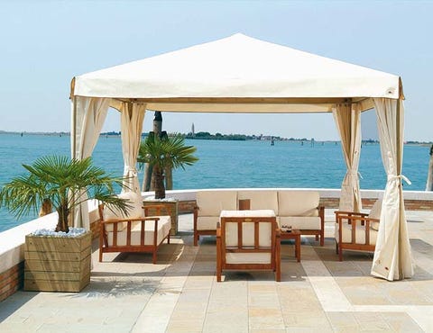 Coastal and oceanic landforms, Furniture, Real estate, Outdoor furniture, Ocean, Shade, Outdoor table, Azure, Resort, Sea, 