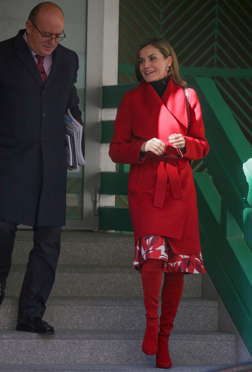 Red, Standing, Fashion, Outerwear, Footwear, Leg, Coat, Thigh, Uniform, Overcoat, 