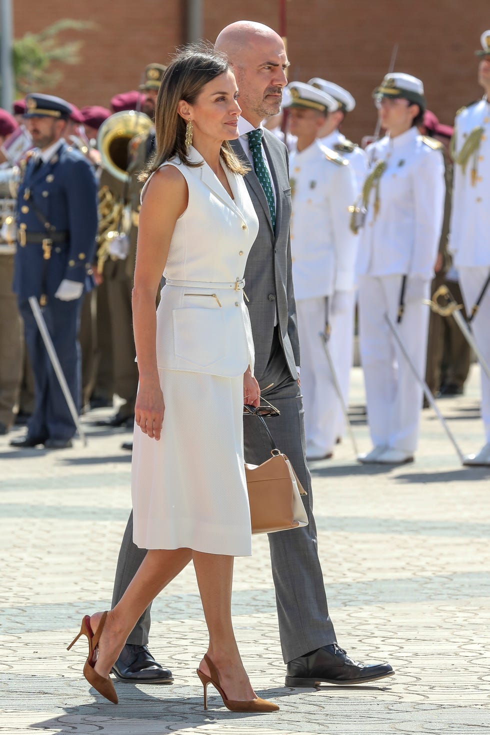 White, Uniform, Fashion, Street fashion, Standing, Footwear, Dress, Formal wear, Suit, Event, 