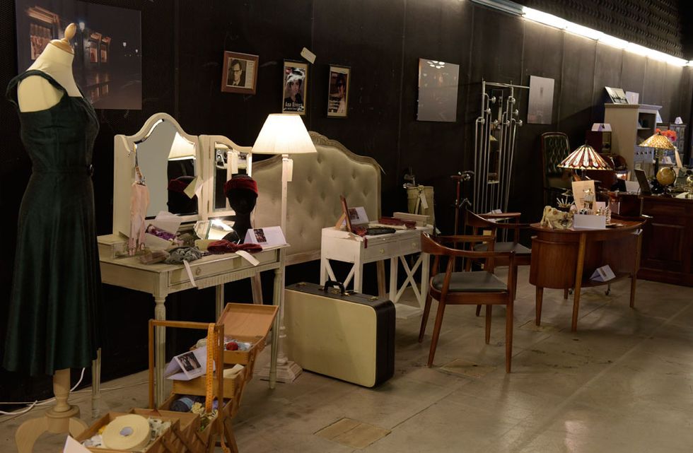 Furniture, Table, Dress, Interior design, Mannequin, Retail, Collection, Costume design, Fashion design, One-piece garment, 