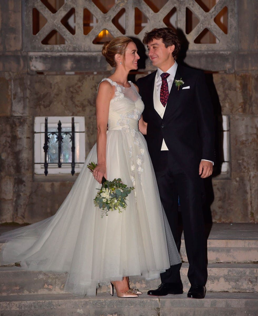 Clothing, Coat, Dress, Trousers, Bridal clothing, Photograph, Standing, Outerwear, Formal wear, Suit, 