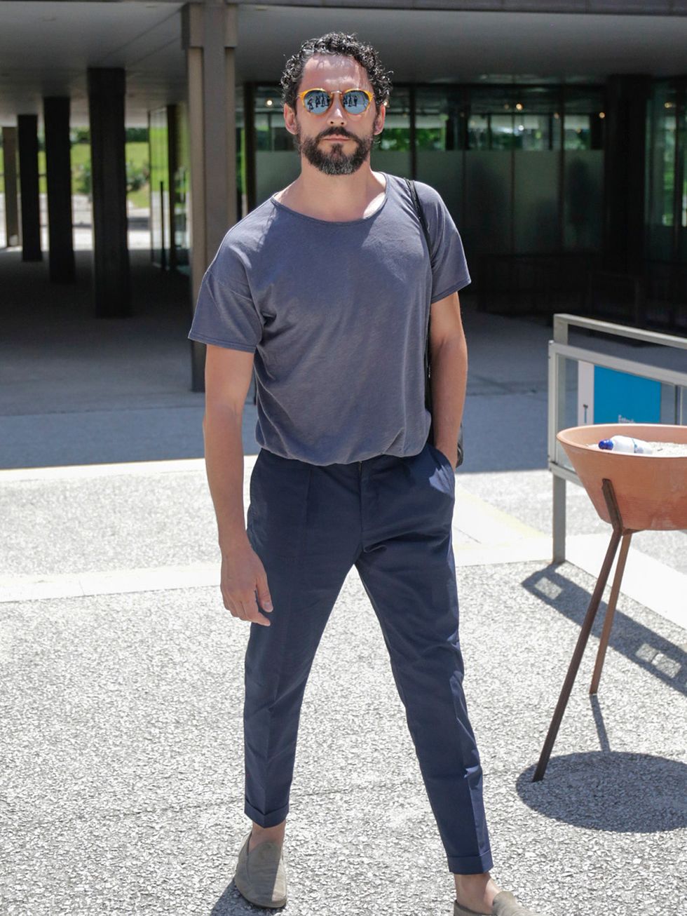 Trousers, Shoe, Denim, Standing, T-shirt, Table, Street fashion, Facial hair, Beard, Cool, 