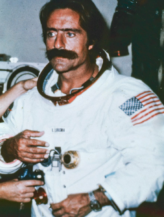 Hand, Astronaut, Drink, Space, Watch, Facial hair, Beer, Moustache, Wine glass, 