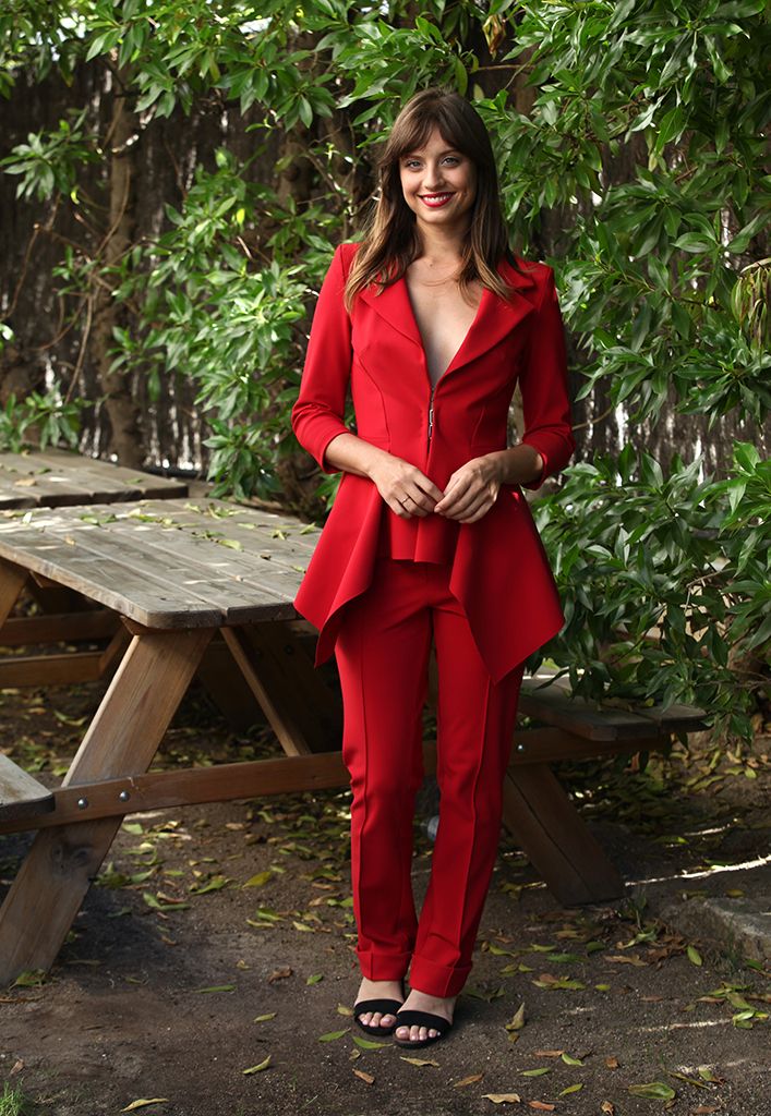 Red, Clothing, Botany, Outerwear, Photo shoot, Photography, Costume, Pantsuit, Long hair, Shoe, 