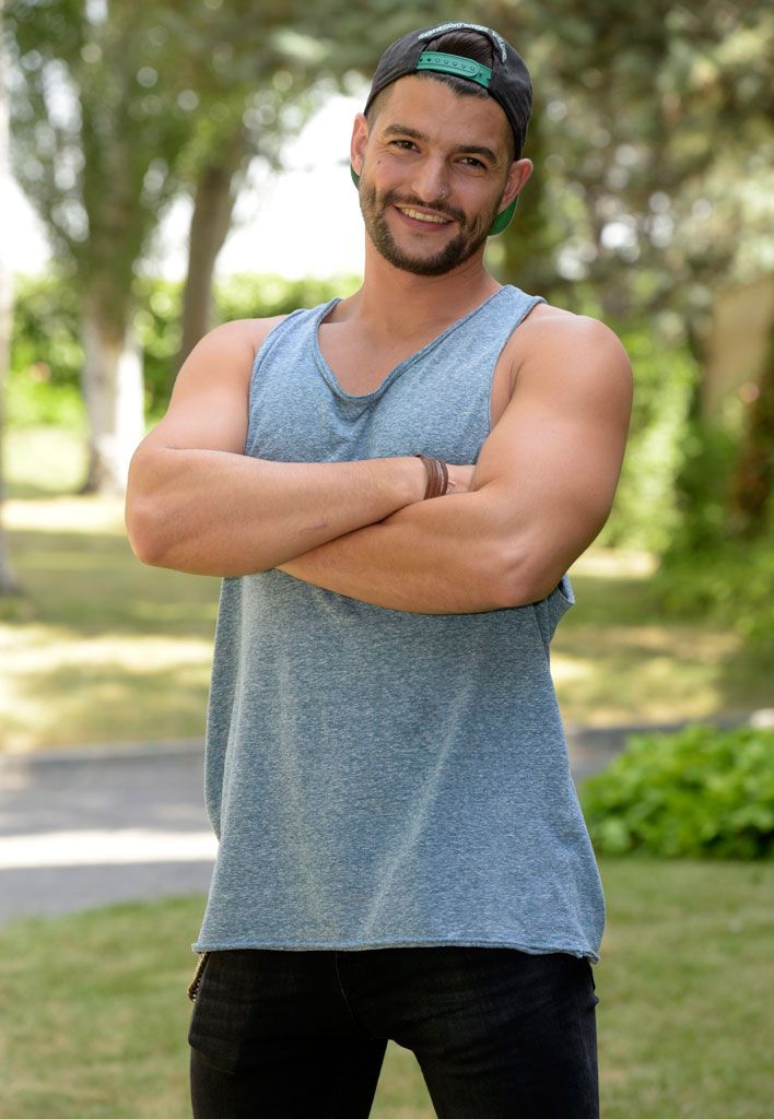 Cap, Shoulder, Standing, Elbow, Chest, People in nature, Muscle, Beard, Sleeveless shirt, Trunk, 