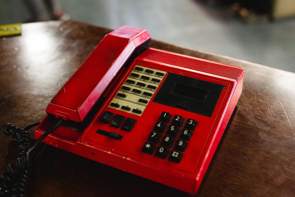 Calculator, Red, Telephone booth, Telephony, Office equipment, Technology, Corded phone, Electronic device, Electronics, Electronic instrument, 