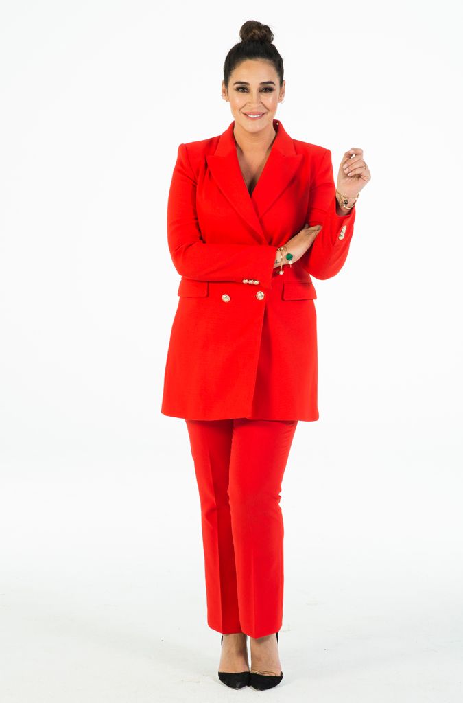 Clothing, Red, Standing, Outerwear, Suit, Pantsuit, Overcoat, Coat, Formal wear, Fashion model, 