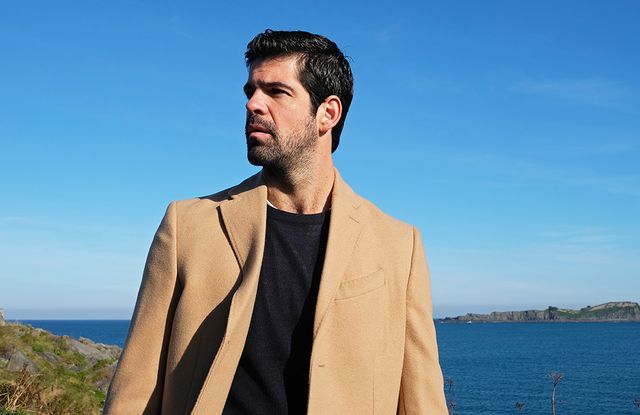 Blue, Sky, Yellow, Daytime, Human, Outerwear, Suit, Photography, Facial hair, Sea, 