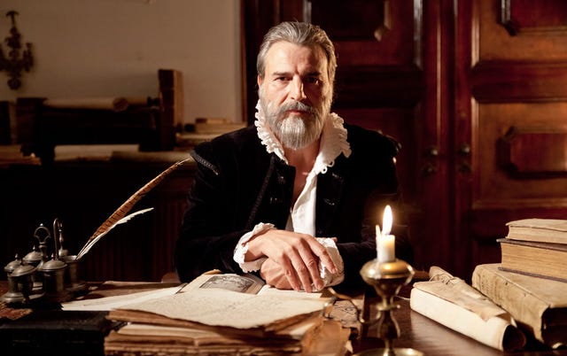 Facial hair, Table, Beard, Candle, Moustache, Desk, Office equipment, Book, Publication, White-collar worker, 