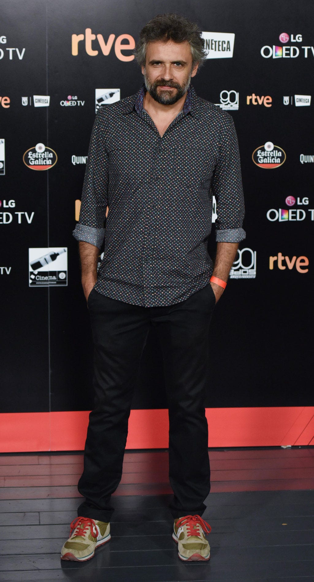 Sleeve, Dress shirt, Shoe, Shirt, Facial hair, Style, Premiere, Collar, Fashion, Logo, 