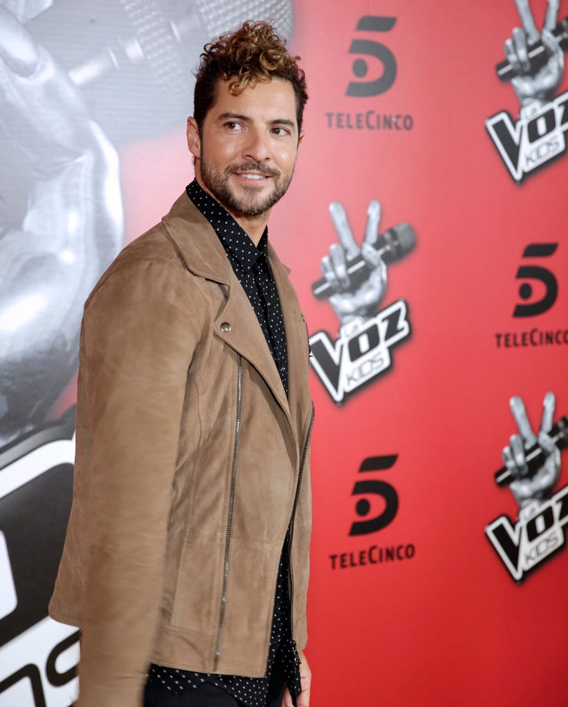 Collar, Style, Jacket, Logo, Facial hair, Blazer, Fashion model, Fashion design, Symbol, Beard, 