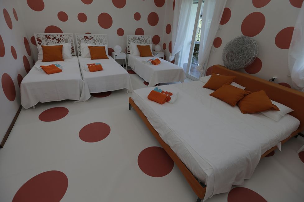 Room, Furniture, Orange, Bed, Property, Bed sheet, Interior design, Bedroom, Bed frame, Floor, 