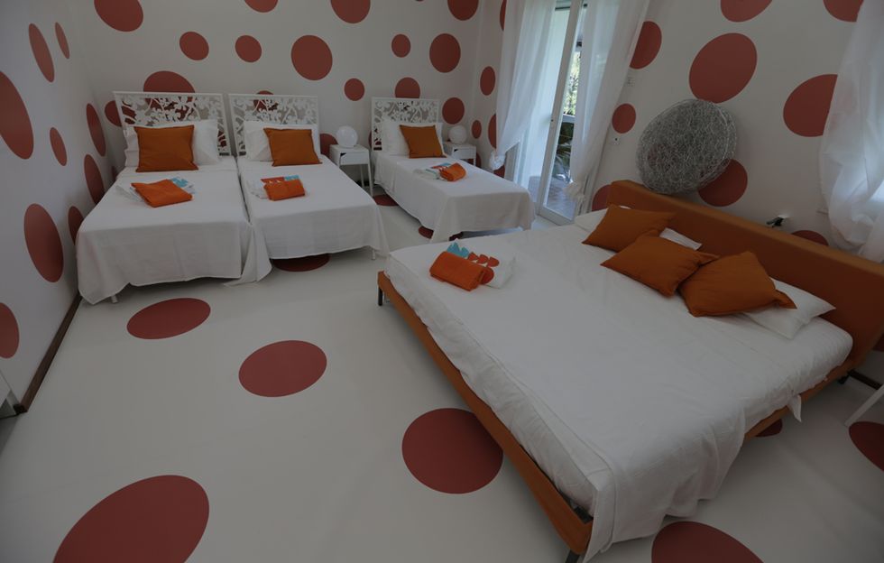 Room, Furniture, Orange, Bed, Property, Bed sheet, Interior design, Bedroom, Bed frame, Floor, 