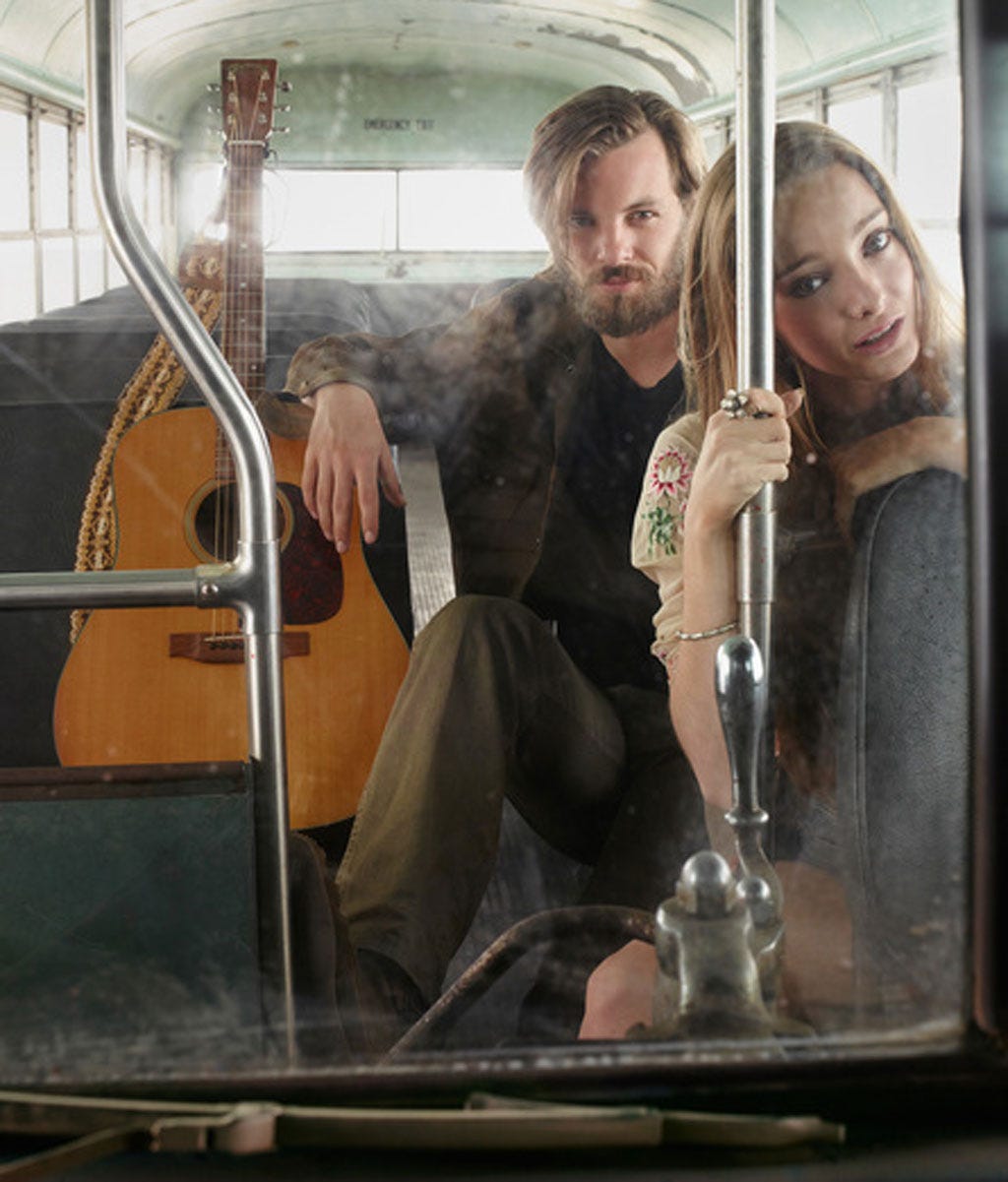 Transport, Hairstyle, Glass, Passenger, Public transport, Facial hair, Sitting, Beard, Windshield, Automotive window part, 