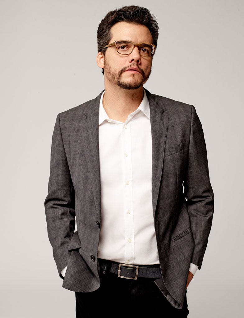 Clothing, Glasses, Facial hair, Dress shirt, Collar, Sleeve, Trousers, Coat, Shoulder, Pocket, 