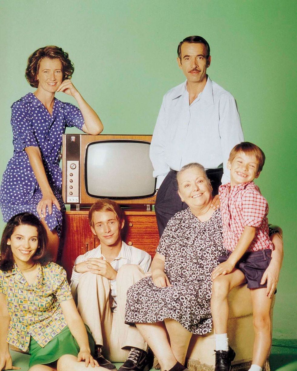 Hair, Face, People, Shirt, Dress, Family pictures, Vintage clothing, Television, Lap, Analog television, 