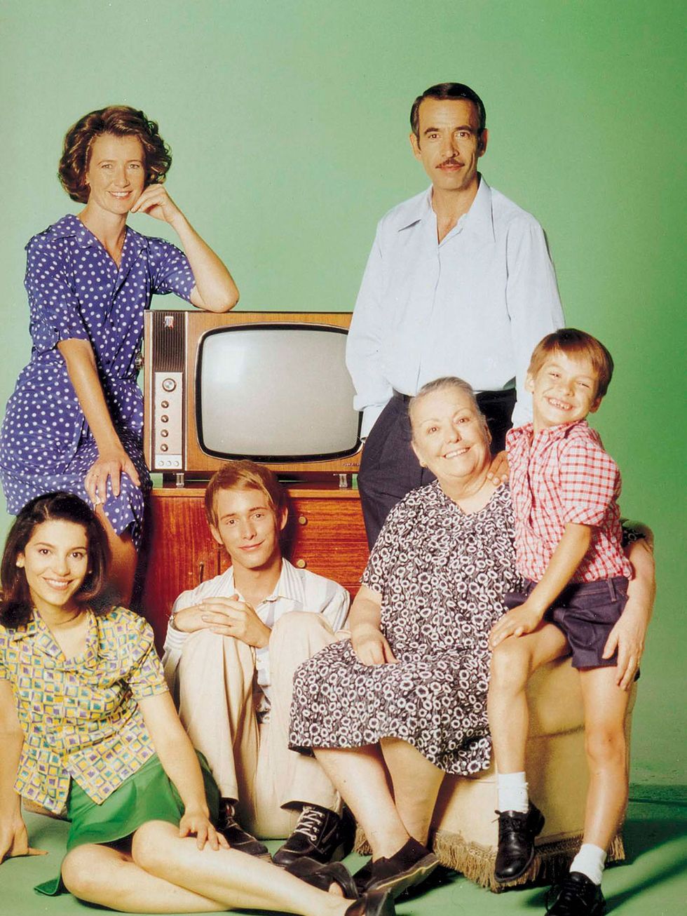 Hair, Face, People, Shirt, Dress, Family pictures, Vintage clothing, Television, Lap, Analog television, 