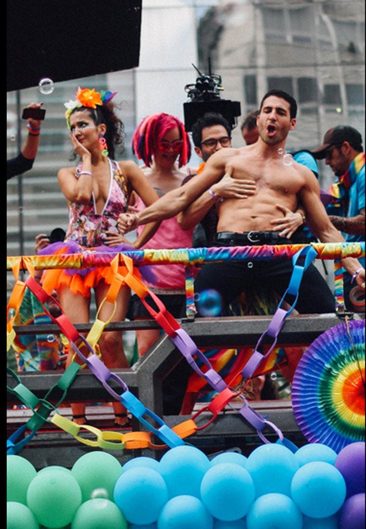 Event, Entertainment, Barechested, Chest, Parade, Muscle, Party supply, Balloon, Party, Public event, 