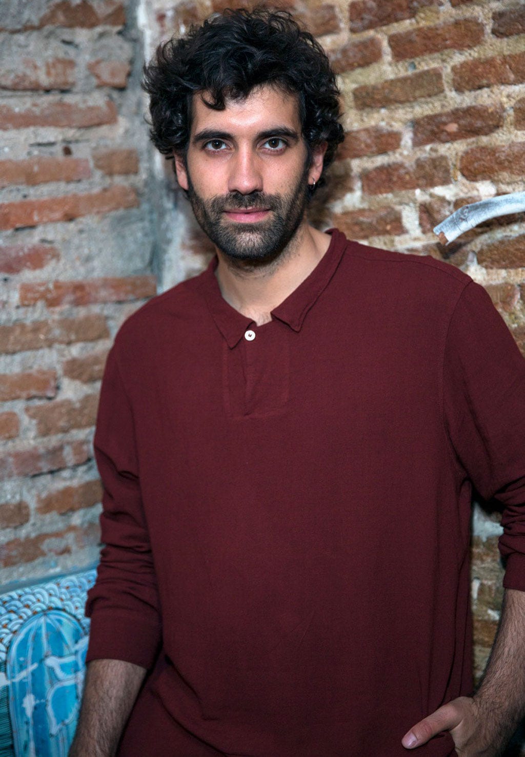 Mouth, Facial hair, Sleeve, Human body, Shoulder, Brick, Collar, Standing, Moustache, Beard, 
